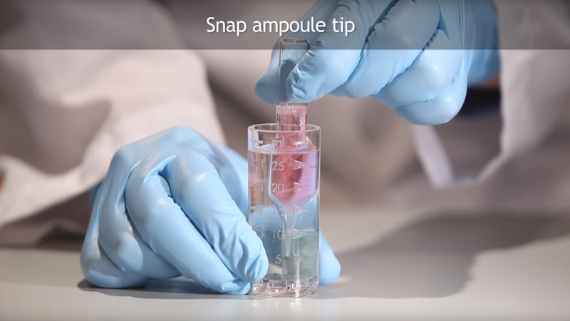 Snap the tip of the ampoule on the bottom and side of the sample cup